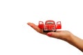 beautiful woman hand holding a red nostalgic toy car Royalty Free Stock Photo