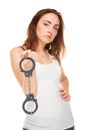 Beautiful woman with handcuffs isolated (focus on handcuffs) Royalty Free Stock Photo