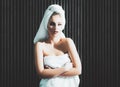 Beautiful woman handle towel, after bath. Beauty portrait of half naked woman with a towel wrapped around her head Royalty Free Stock Photo