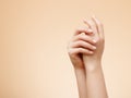 Beautiful Woman Hands. Female Hands Applying Cream, Lotion. Spa and Manicure concept. Female hands with french manicure. Soft skin Royalty Free Stock Photo