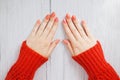 Beautiful woman hands with gently coral manicure on nails. Cream for hands and treatment. Hand skin care