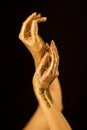 Beautiful woman hands in gold, golden hands, glitter sensual glamour luxury Royalty Free Stock Photo