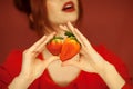 Beautiful woman hands holding some strawberries in her hands