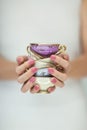 Beautiful woman hands with perfect pink nail polish holding little vintage tea cups Royalty Free Stock Photo