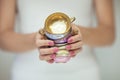Beautiful woman hands with perfect pink nail polish holding little vintage tea cups Royalty Free Stock Photo