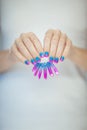 Beautiful woman hands with perfect violet pink and turquoise nail polish Royalty Free Stock Photo