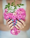 Beautiful woman hands with perfect violet pink and turquoise nail polish holding pink roses Royalty Free Stock Photo