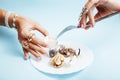 Beautiful woman hands with pink manicure holding plate with pearls and sea shells, luxury jewelry concept