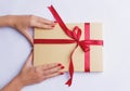 Woman hands holding a gift box