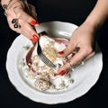 Beautiful woman hands with red pattern polish manicured nails an Royalty Free Stock Photo