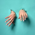 Beautiful woman hands with yellow pink white pattern nail polish Royalty Free Stock Photo