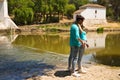 Beautiful woman and handsome man latinos dancing bachata are dancing by the river in the forest. The couple do different postures Royalty Free Stock Photo