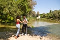 beautiful woman and handsome man latinos dancing bachata are dancing by the river in the forest. The couple do different postures Royalty Free Stock Photo