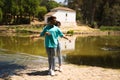 beautiful woman and handsome man latinos dancing bachata are dancing by the river in the forest. The couple do different postures Royalty Free Stock Photo