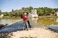 beautiful woman and handsome man latinos dancing bachata are dancing by the river in the forest. The couple do different postures Royalty Free Stock Photo