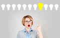 Beautiful woman has an idea. Light bulbs Royalty Free Stock Photo