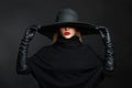 Beautiful woman in hat and leather gloves.halloween witch Royalty Free Stock Photo