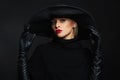 Beautiful woman in hat and leather gloves.halloween witch Royalty Free Stock Photo