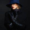 Beautiful woman in hat and leather gloves. Retro fashion girl Royalty Free Stock Photo