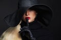 Beautiful woman in hat and leather gloves. Retro fashion model girl.halloween witch Royalty Free Stock Photo