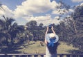 Beautiful Woman In Hat Making Photo Picture Of Tropical Forest From Hotel Balcony Or Terrace Back Rear View Royalty Free Stock Photo