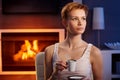 Beautiful woman having coffee in cosy room