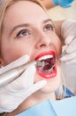 Beautiful woman having dental exam Royalty Free Stock Photo