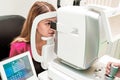 Beautiful woman having an eye lens exam Royalty Free Stock Photo