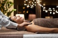 beautiful woman having hot stone massage at spa Royalty Free Stock Photo