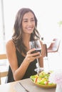 Beautiful woman having wine with meal Royalty Free Stock Photo