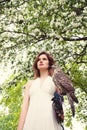 Beautiful Woman with Hawk on Blossom Royalty Free Stock Photo