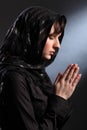 Beautiful woman in headscarf praying eyes closed Royalty Free Stock Photo