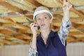 beautiful woman in helmet using walkie-talkie Royalty Free Stock Photo