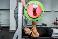 Beautiful woman helping men to lift dumbbell Royalty Free Stock Photo