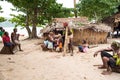 Villagers with children in front of straw hut, Nemba, Utupua, Solomon Islands, South Pacific Islands