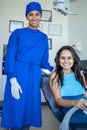 Beautiful woman with her dentist smiles looking at the camera.