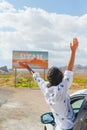 Beautiful woman on her trip by the car. Welcome to Utah road sign. Large welcome sign greets travels in Monument Valley Royalty Free Stock Photo