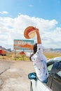 Beautiful woman on her trip by the car. Welcome to Utah road sign. Large welcome sign greets travels in Monument Valley Royalty Free Stock Photo