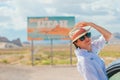 Beautiful woman on her trip by the car. Welcome to Utah road sign. Large welcome sign greets travels in Monument Valley Royalty Free Stock Photo