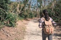 Beautiful woman hiker hike on forest trail Royalty Free Stock Photo