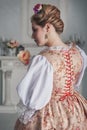 Beautiful woman in historic medieval dress. Back pose Royalty Free Stock Photo