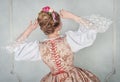 Beautiful woman in historic medieval dress. Back pose Royalty Free Stock Photo