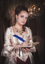 Beautiful woman in historic medieval dress with diary Royalty Free Stock Photo