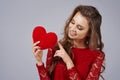 Beautiful woman holding artificial heart