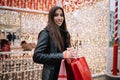 Beautiful woman holding bags while shopping for presents Royalty Free Stock Photo