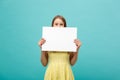 Beautiful woman holding a blank billboard on blue background Royalty Free Stock Photo