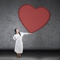 Beautiful woman holding blank heart sign Royalty Free Stock Photo