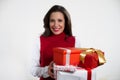 Beautiful woman holding Christmas gifts