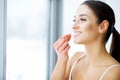 Beautiful Woman Holding Fish Oil Pill In Hand. Healthy Nutrition Royalty Free Stock Photo