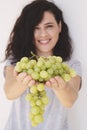 Beautiful woman, holding fresh green grape in hand Royalty Free Stock Photo